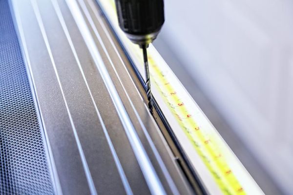 Campbell Security Screens are secured into the wooden studs with tamper resistant fasteners covered under a secure cap.